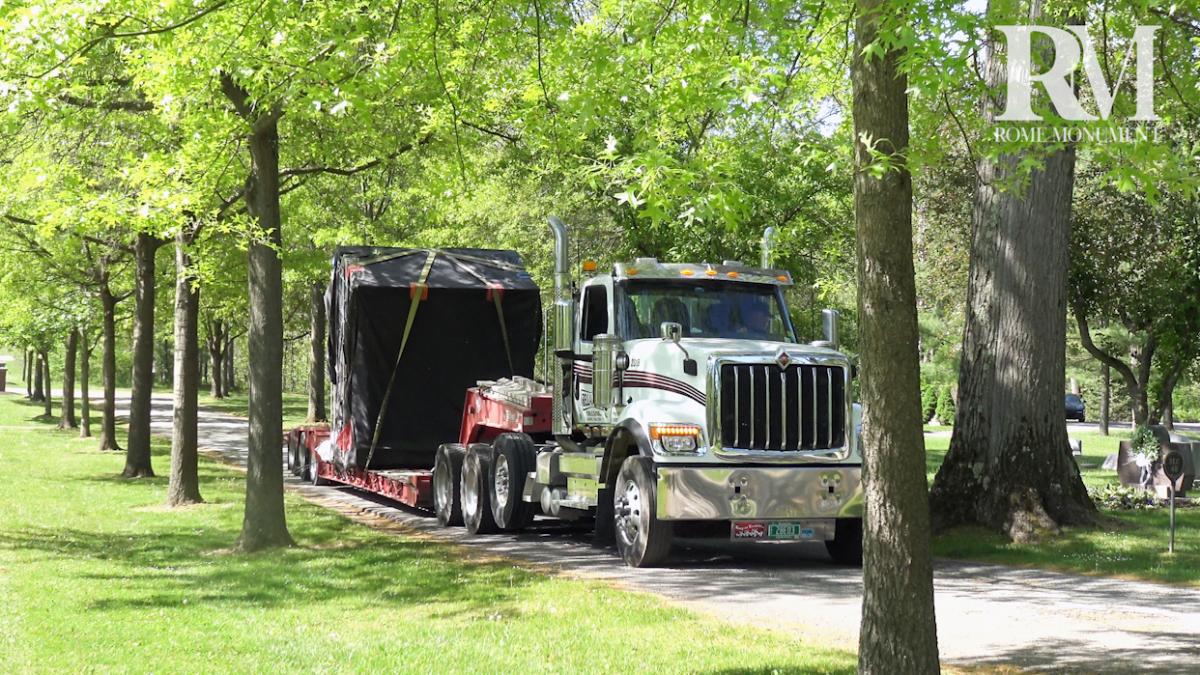 See a Lowboy Truck Carry the Mausoleum to the Plot